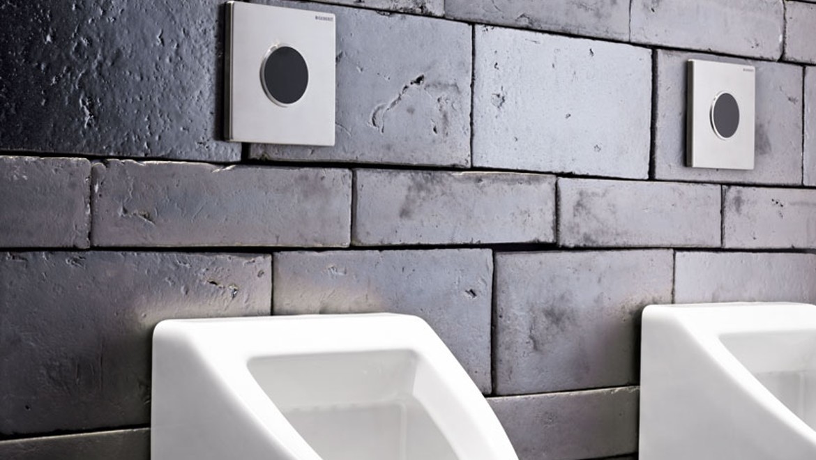 Type 10 urinal flush plates on stone wall Type 10 urinal flush plates on stone wall