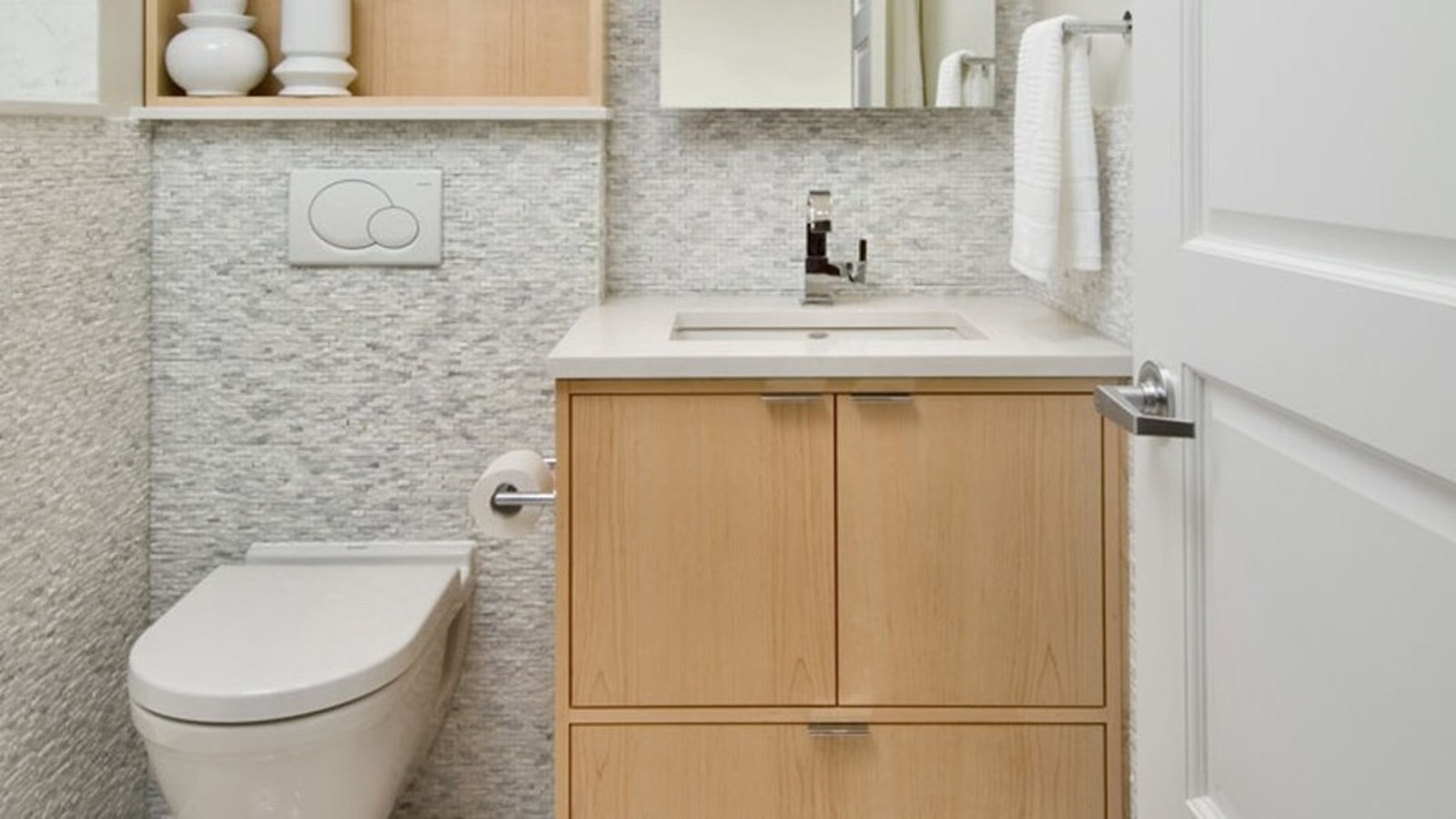 Half bath using a back-to-back connector to main bath's plumbing system Half bath using a back-to-back connector to main bath's plumbing system