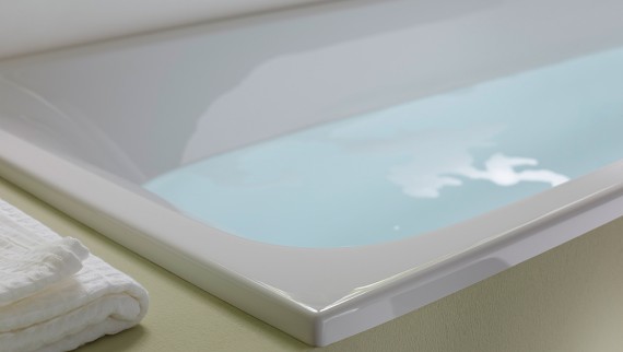 A full bathtub with Geberit bath waste and overflow A full bathtub with Geberit bath waste and overflow