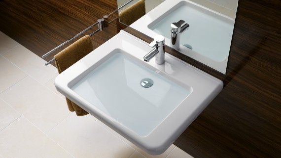 Accessible wall-hung sink with space-saving lavatory trap