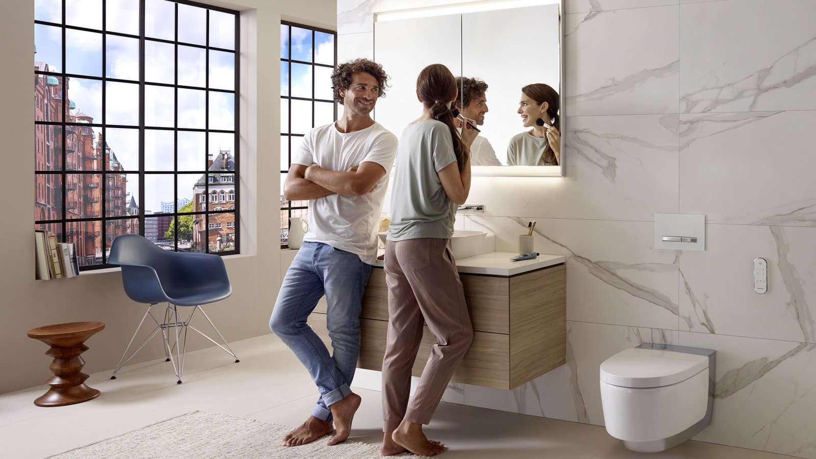 Couple in an apartment bathroom with wall-hung fixtures