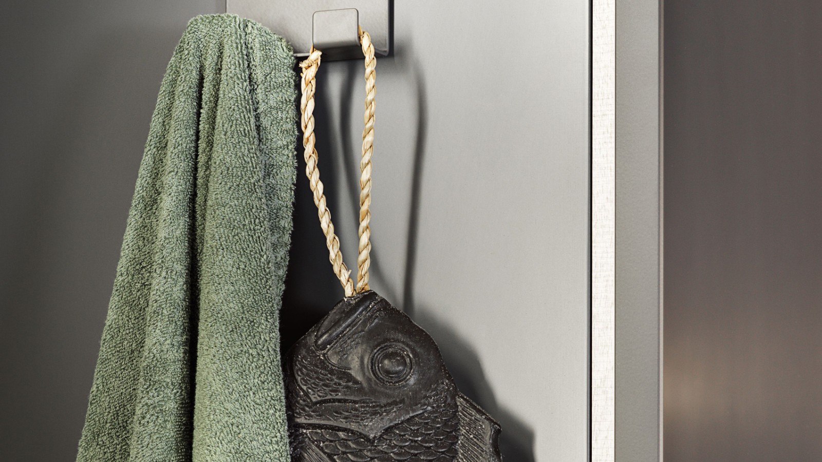 Towel on hook from the Geberit Acanto bathroom series Towel on hook from the Geberit Acanto bathroom series