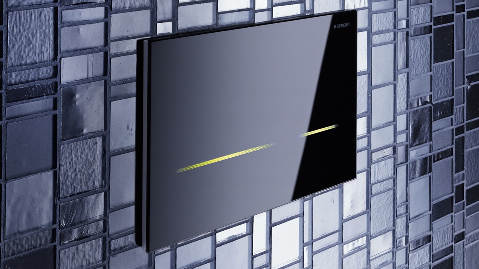 Geberit Sigma80 flush actuator plate on a glass tile wall Geberit Sigma80 flush actuator plate on a glass tile wall