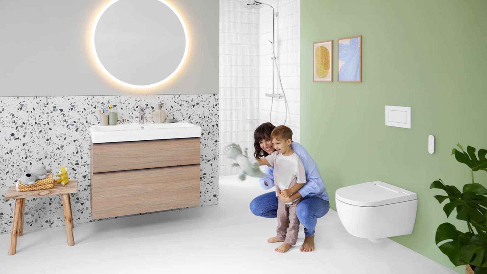 Mother and child in bright bathroom with Sigma10 Square flush plate Mother and child in bright bathroom with Sigma10 Square flush plate