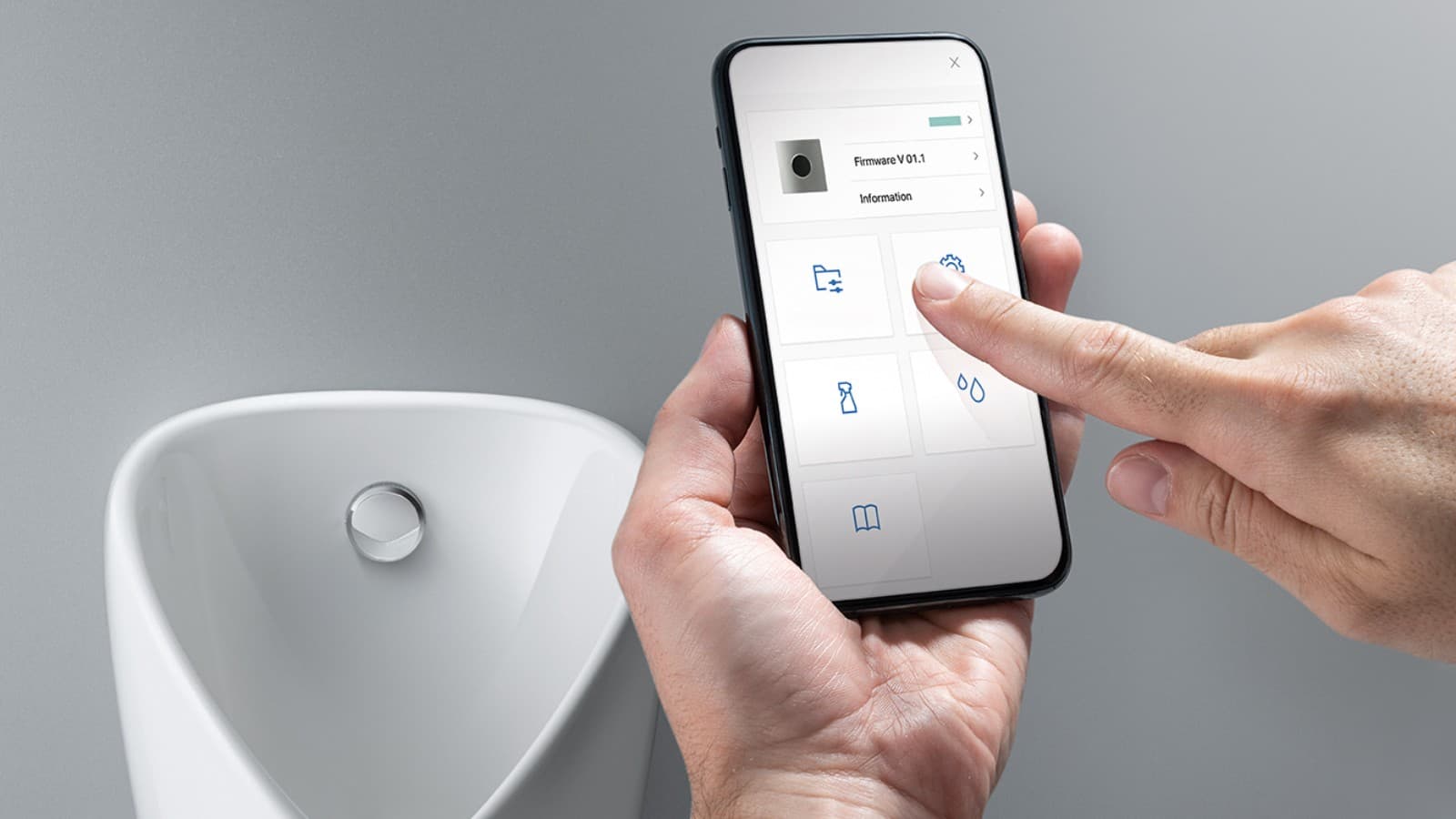 Smartphone communicating with a Geberit urinal flush actuator Smartphone communicating with a Geberit urinal flush actuator